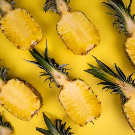 backdrop of ripe pineapple halves with sweet flesh